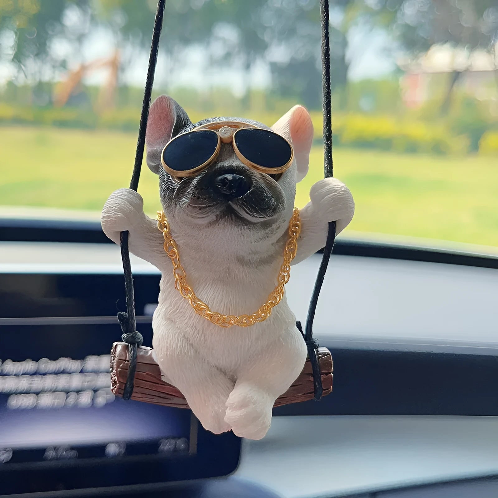 Cartoon-style resin bulldog car pendant hanging ornament in black, white, or yellow.