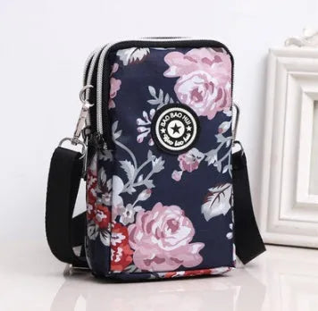 Vertical mobile phone bag in black with Oxford Spinning texture and zipper closure