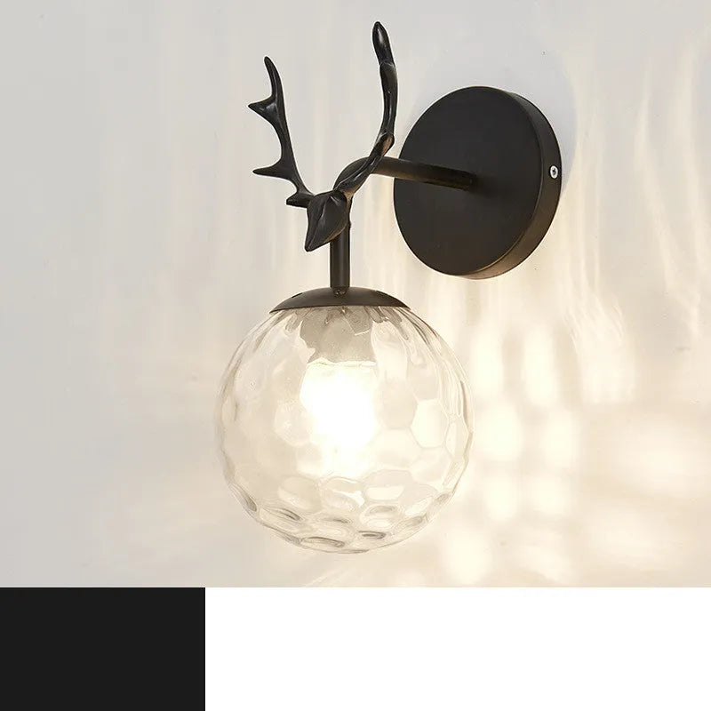 Modern round glass wall sconce with a Nordic design, mounted on a white wall, showing its light-diffusing shade and compact 30cm diameter.