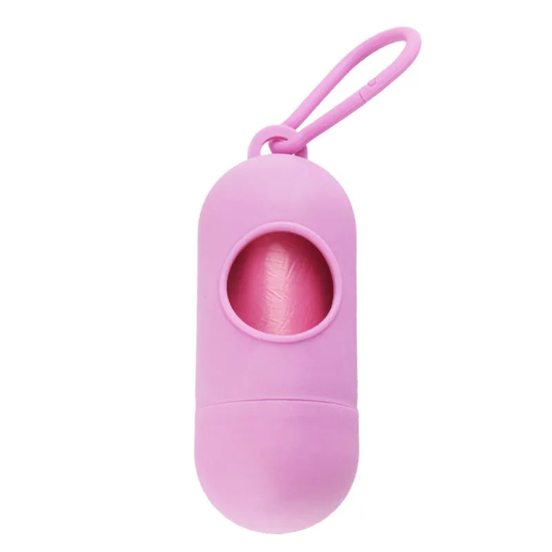 Black plastic dog poop bag dispenser with Velcro strap and a side metal hook.