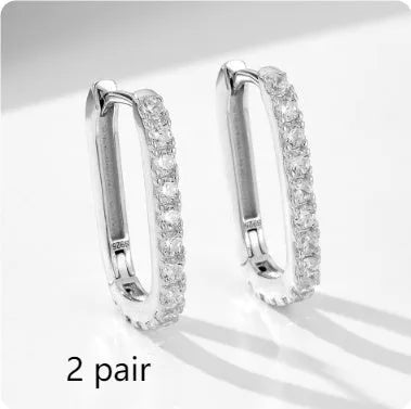 Sterling Silver oval geometric zircon ear clip earrings for women on a white background.