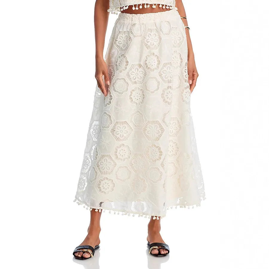Literary Trends white women's suit with embroidered long skirt and sleeveless top on a hanger