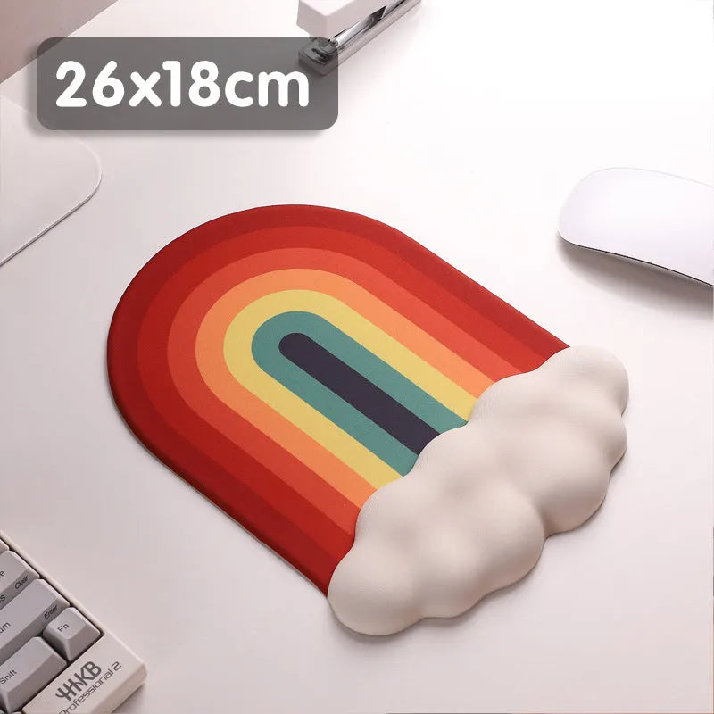 Silicone wrist rest mouse pad and keyboard holder set with cloud pattern on a desk.