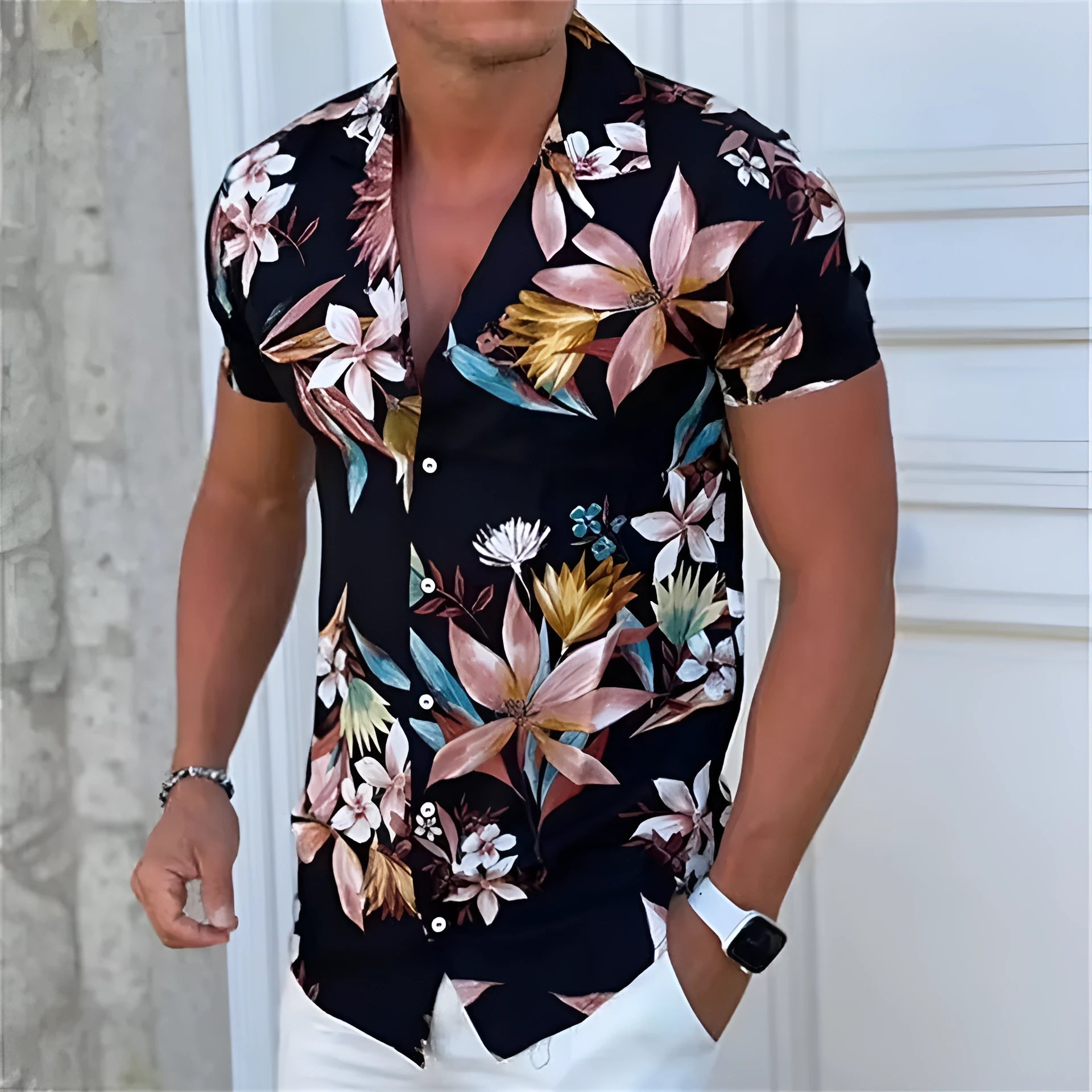 Man wearing a loose-fit short sleeve floral print shirt in a cardigan style