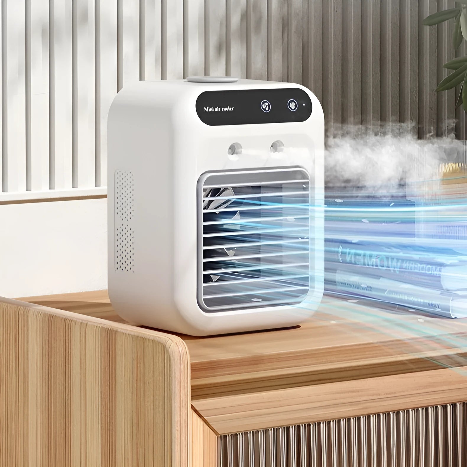 Ivory white portable air cooler with touchscreen panel and USB cable on a desk