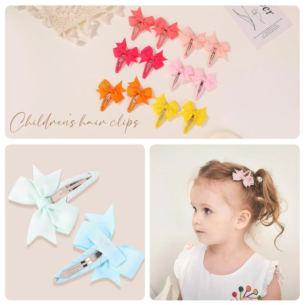 40 assorted colour grosgrain ribbon baby hair bow clips with fully wrapped snap barrettes on a white background.