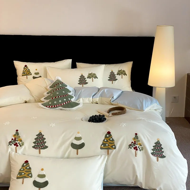 Cream Blue pure cotton duvet cover with raised white Christmas tree embroidery, paired with a fitted sheet and pillowcases.