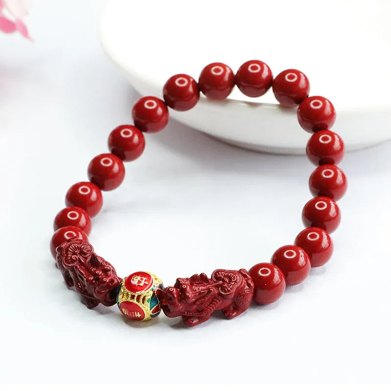 Close-up of a purple gold sand carved cinnabar women's bracelet with a double Pixiu design.
