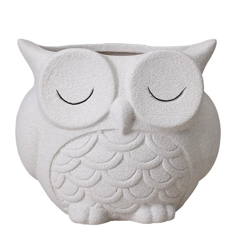 Handmade frosted owl ceramic succulent pot in light pink, showing cartoon design and 11cm size.