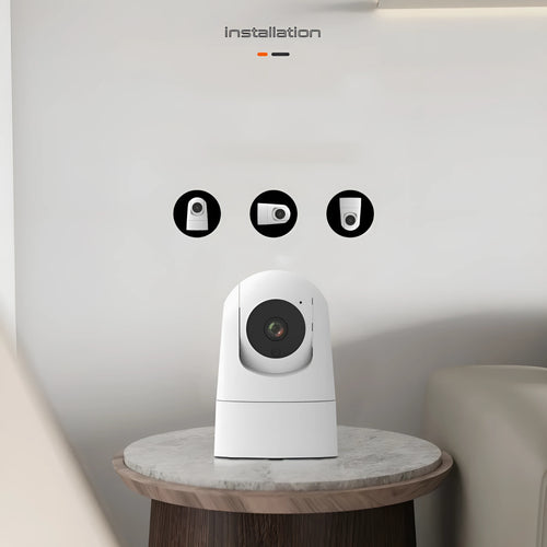 White indoor pan tilt security camera with lens on a compact square base, showing remote movement and two-way audio features.