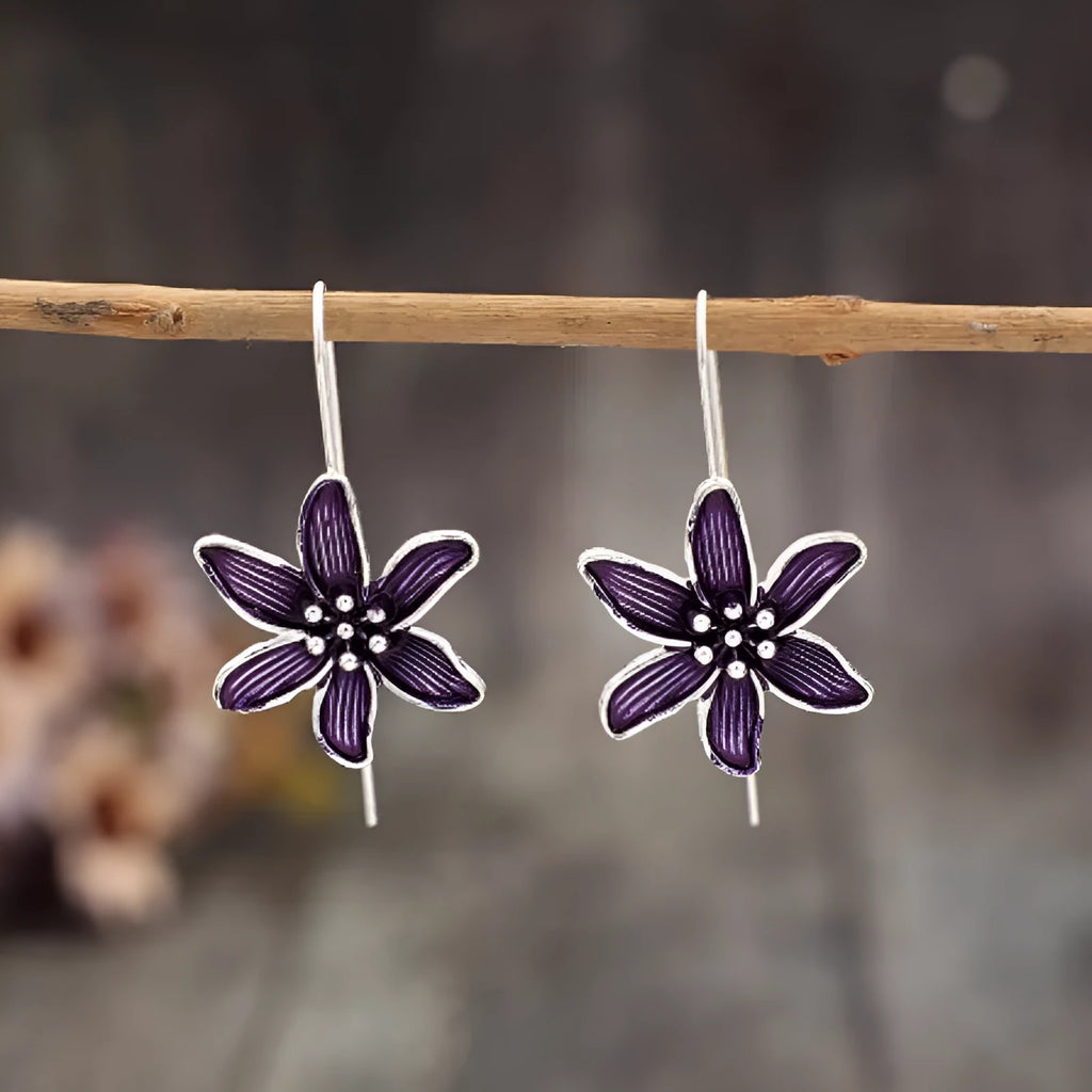 A pair of purple retro flower-shaped alloy earrings with an electroplated finish.