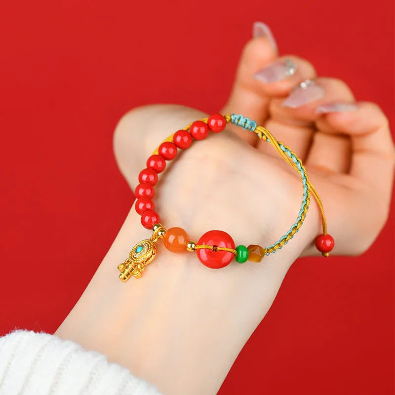 Red hand-woven cinnabar bracelet with geometric peace blessing buckle charm