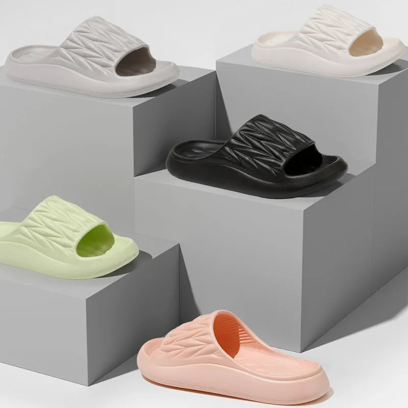 Leaf texture design EVA foam indoor slippers in assorted colours on a white background.