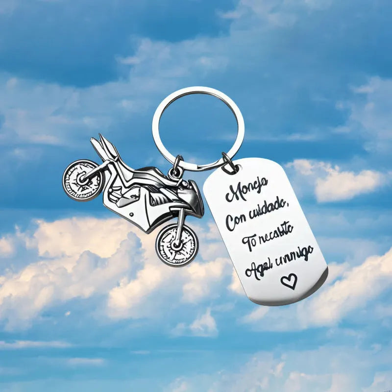 Stainless steel motorcycle-themed keychain with charm and a red flannel storage pouch.