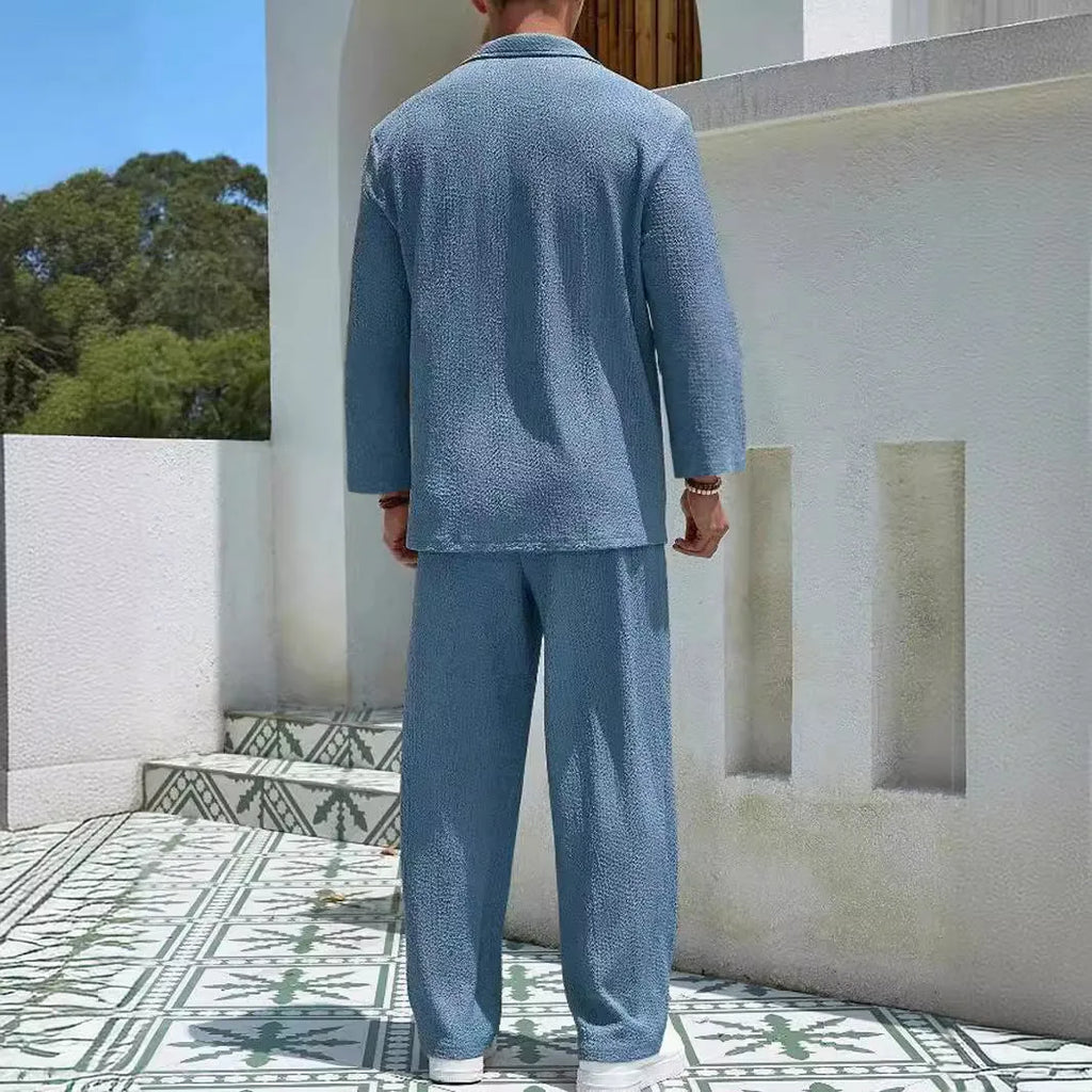 Men's casual shirt trousers suit in polyester, shown in lake blue, with shirt-style jacket and matching trousers.