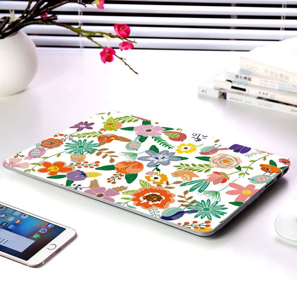 Plastic laptop protective shell with a floral pattern design for MacBook Air and MacBook Pro models.