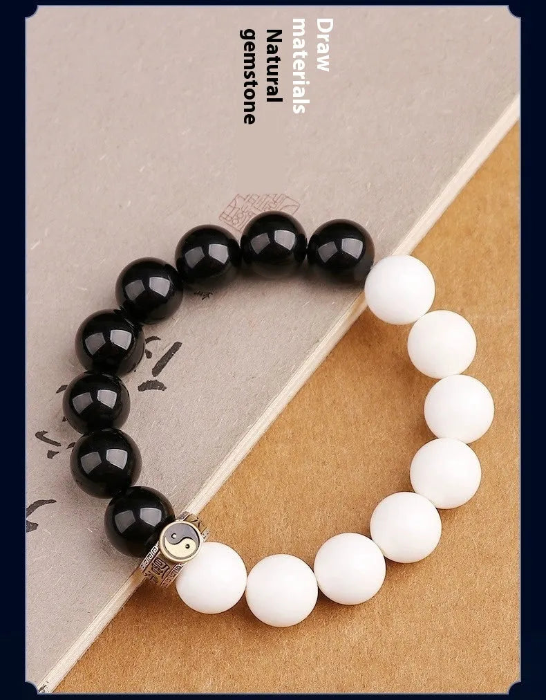 Geometric black and white obsidian Tai Chi bracelet with woven six-word mantra pattern