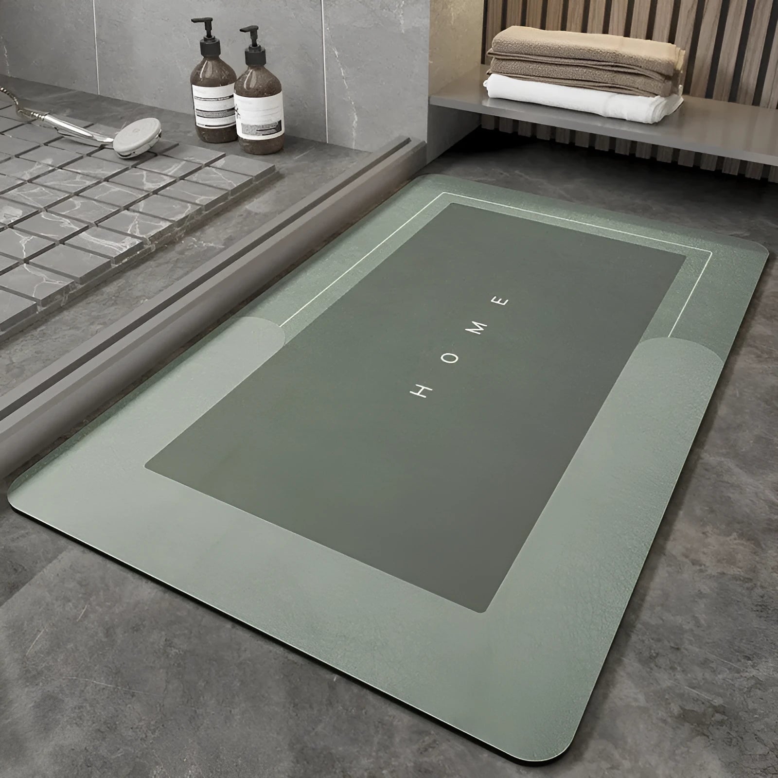 Machine-woven blended bathroom floor mat in blue, shown in an oval shape on a tiled floor.