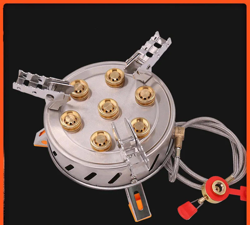 Camping stove with seven burners set on a stable steel frame for group outdoor cooking