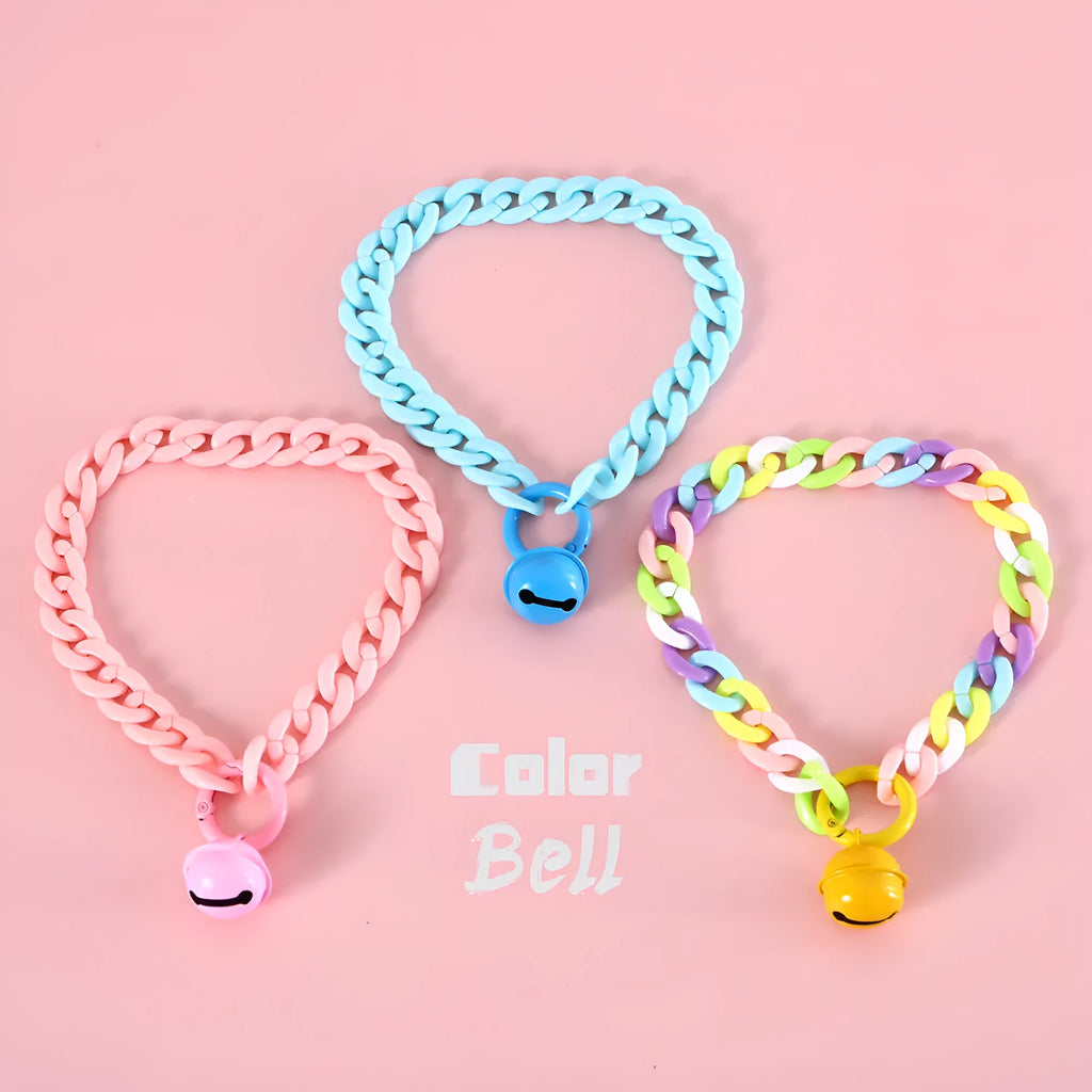 Adjustable plastic pet collar in macaron candy colours with chain detailing, shown with a buckle.