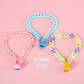 Adjustable plastic pet collar in macaron candy colours with chain detailing, shown with a buckle.