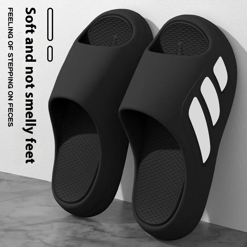EVA platform slipper in a two-tone red and black colour with a lettered design on the upper.