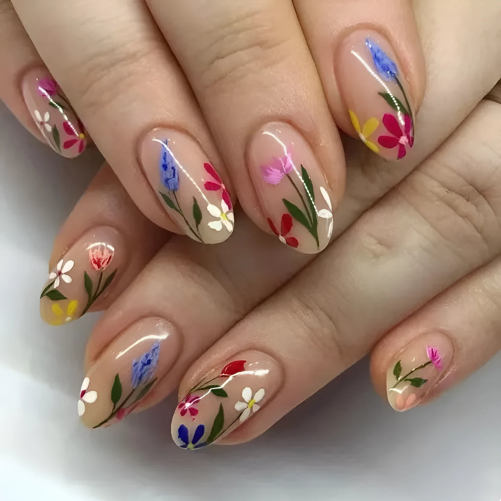 Almond-shaped removable nail art set featuring rose, tulip, and flower patterns on a hand.