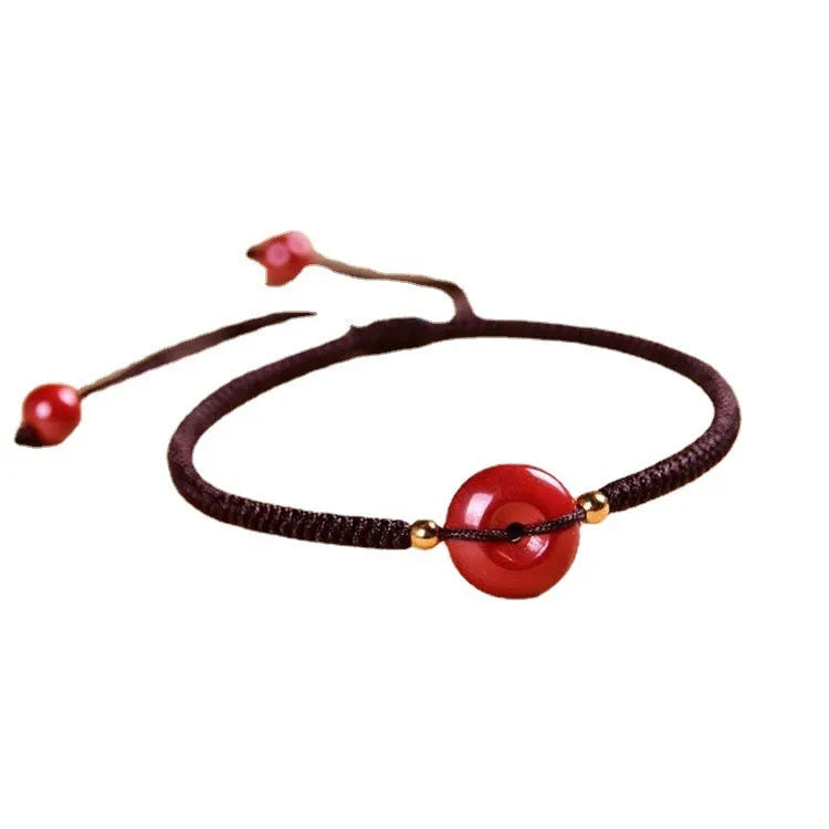 Cinnabar heart charm bracelet with adjustable red rope and traditional safety buckle in multiple colour options
