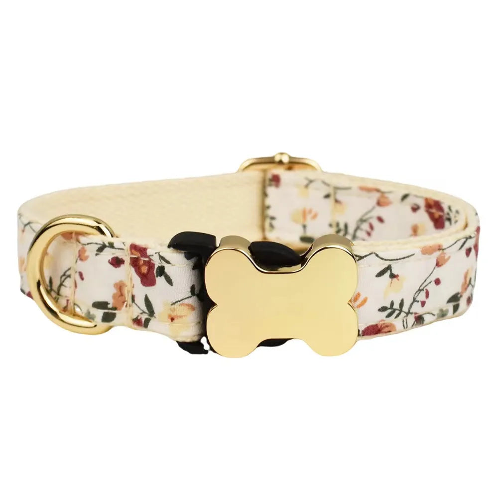Flat nylon dog collar with printed grid pattern and white bone-shaped plastic buckle on a blue background.