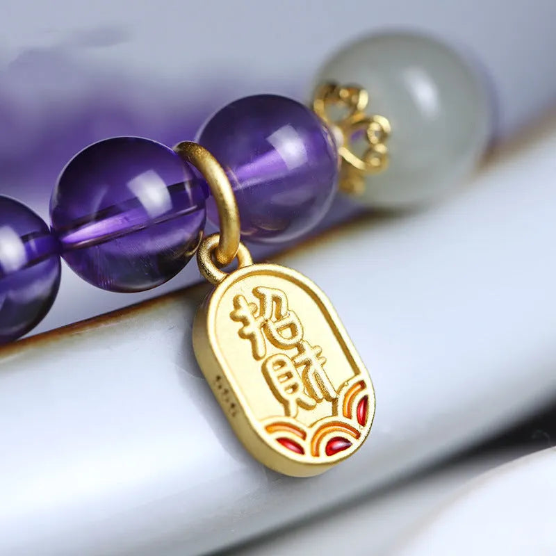 Amethyst colour crystal bead bracelet with 8mm round beads in a geometric national style design.