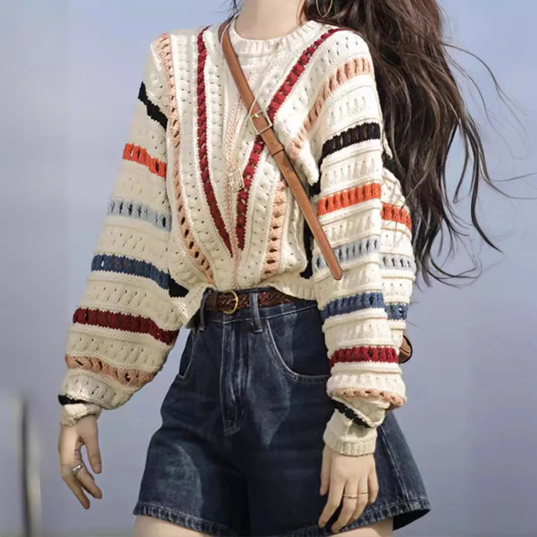Retro rainbow striped loose sweater with batwing sleeves and a round neck.