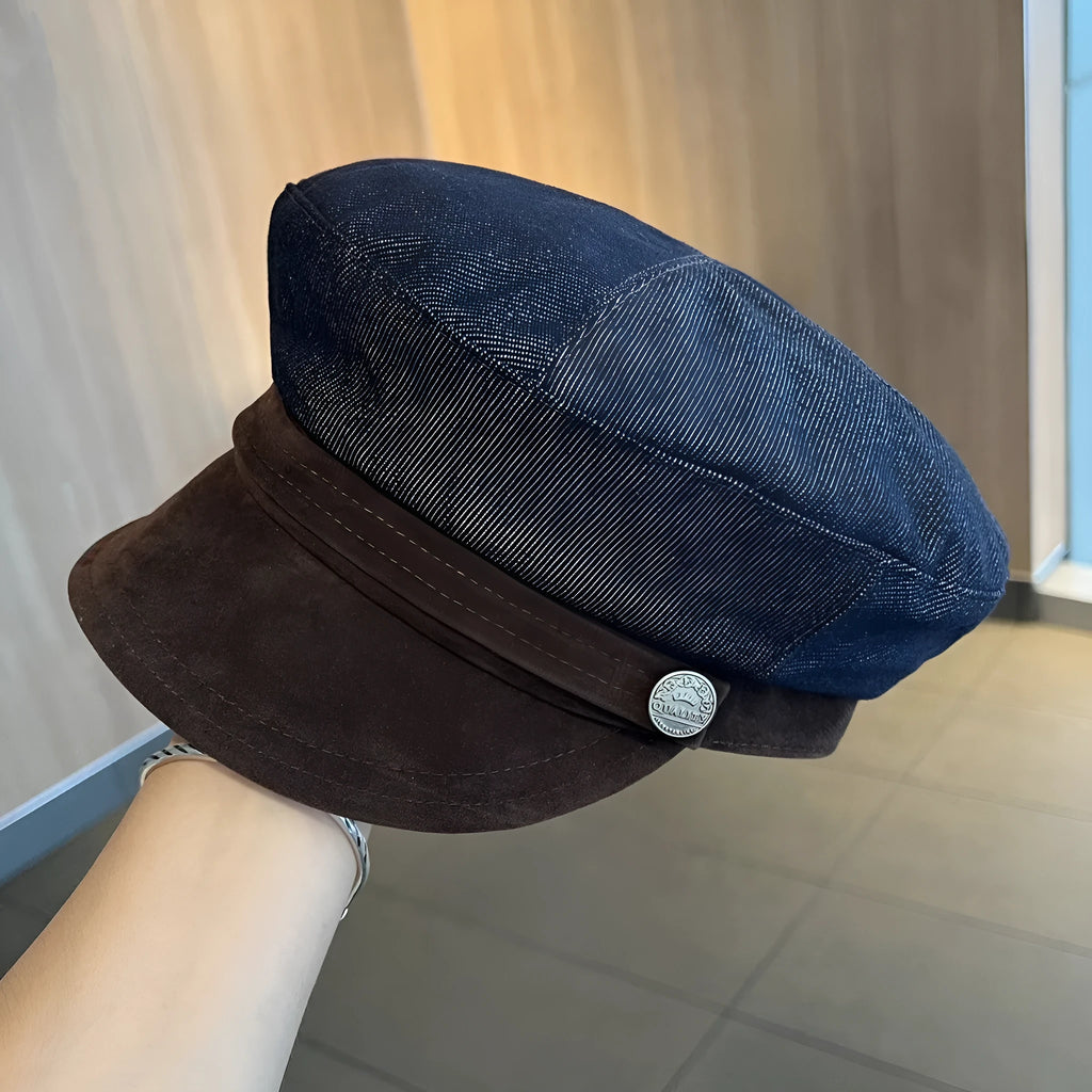 Dark blue denim newsboy hat with octagonal retro design and adjustable sizing