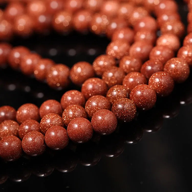 Golden star stone bracelet with 108 nugget sand beads and a fu character charm.