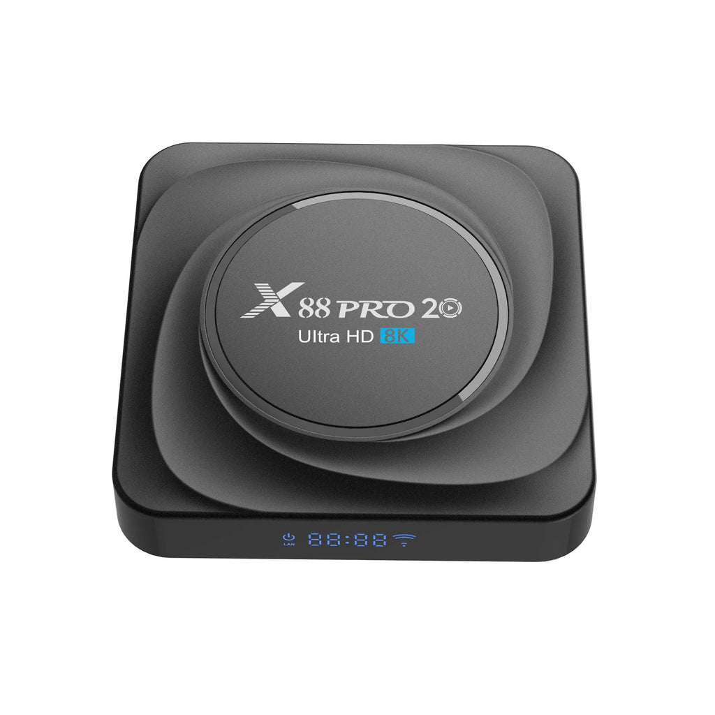 Black Android TV set-top box with HDMI port, shown with remote control and UK plug power adapter.