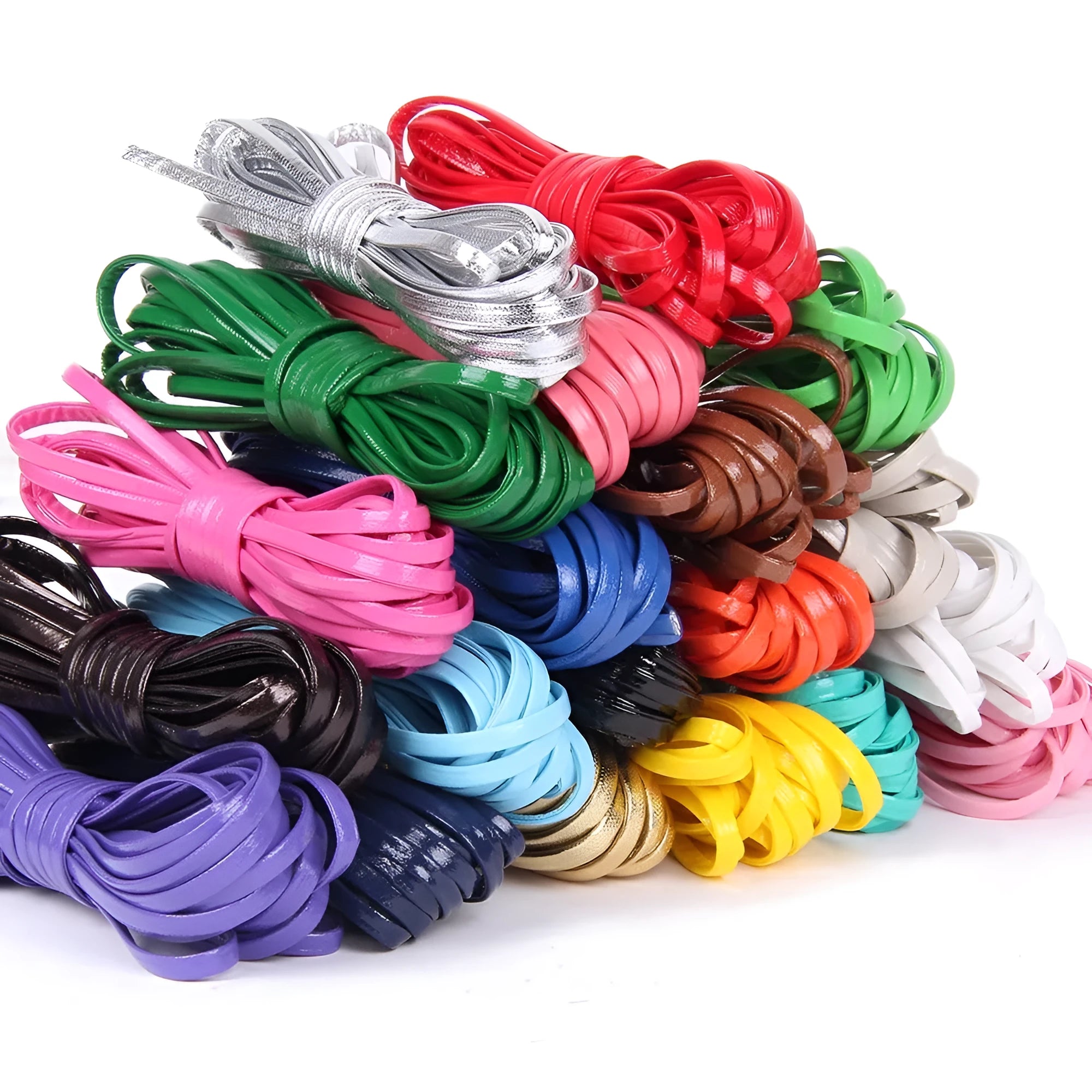 Coils of PU leather cord in multiple colours including black, brown, red, blue, and gold on a white background.