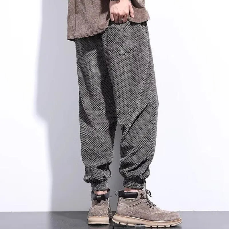 Men's grey ankle-tied casual sport sweatpants with straight leg design on hanger