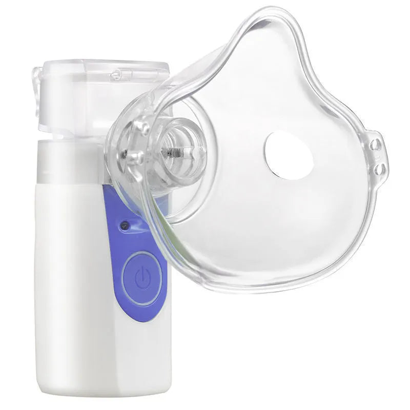White columnar handheld USB nebuliser spray machine on a table with data cable.