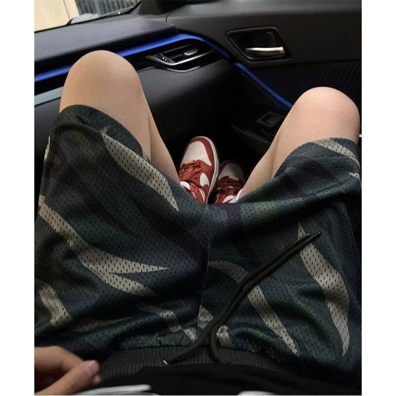 Men's camouflage mesh shorts in straight leg design with cotton blend fabric