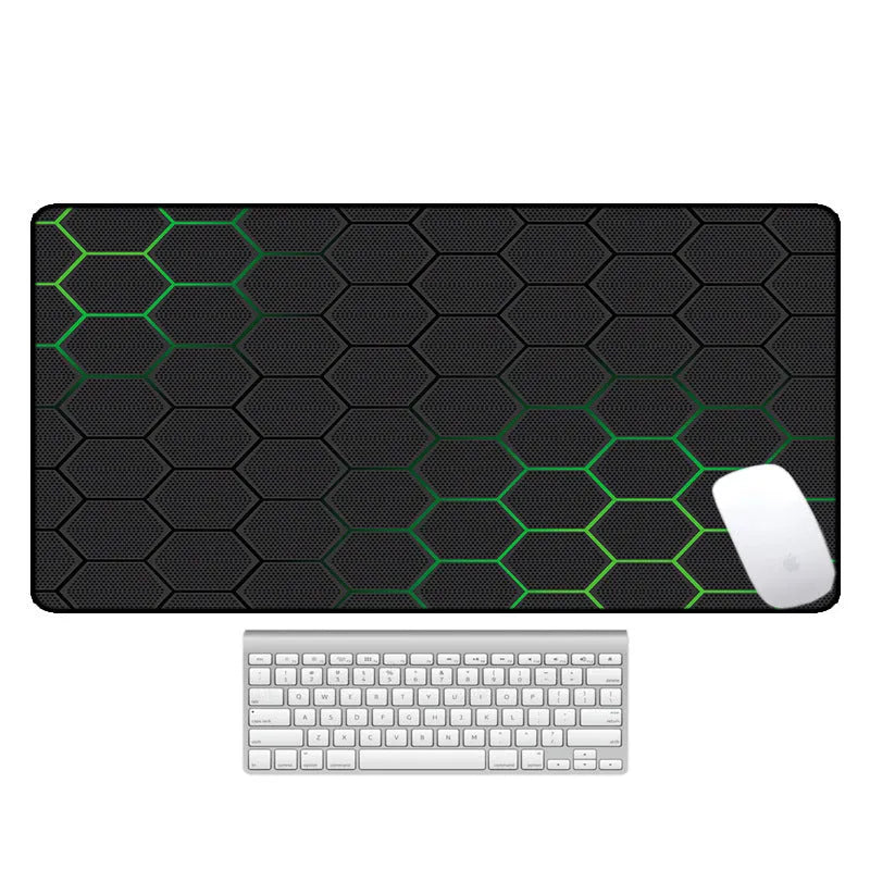 Large printed desk mouse pad with natural rubber non-slip base, shown on a wooden desk.