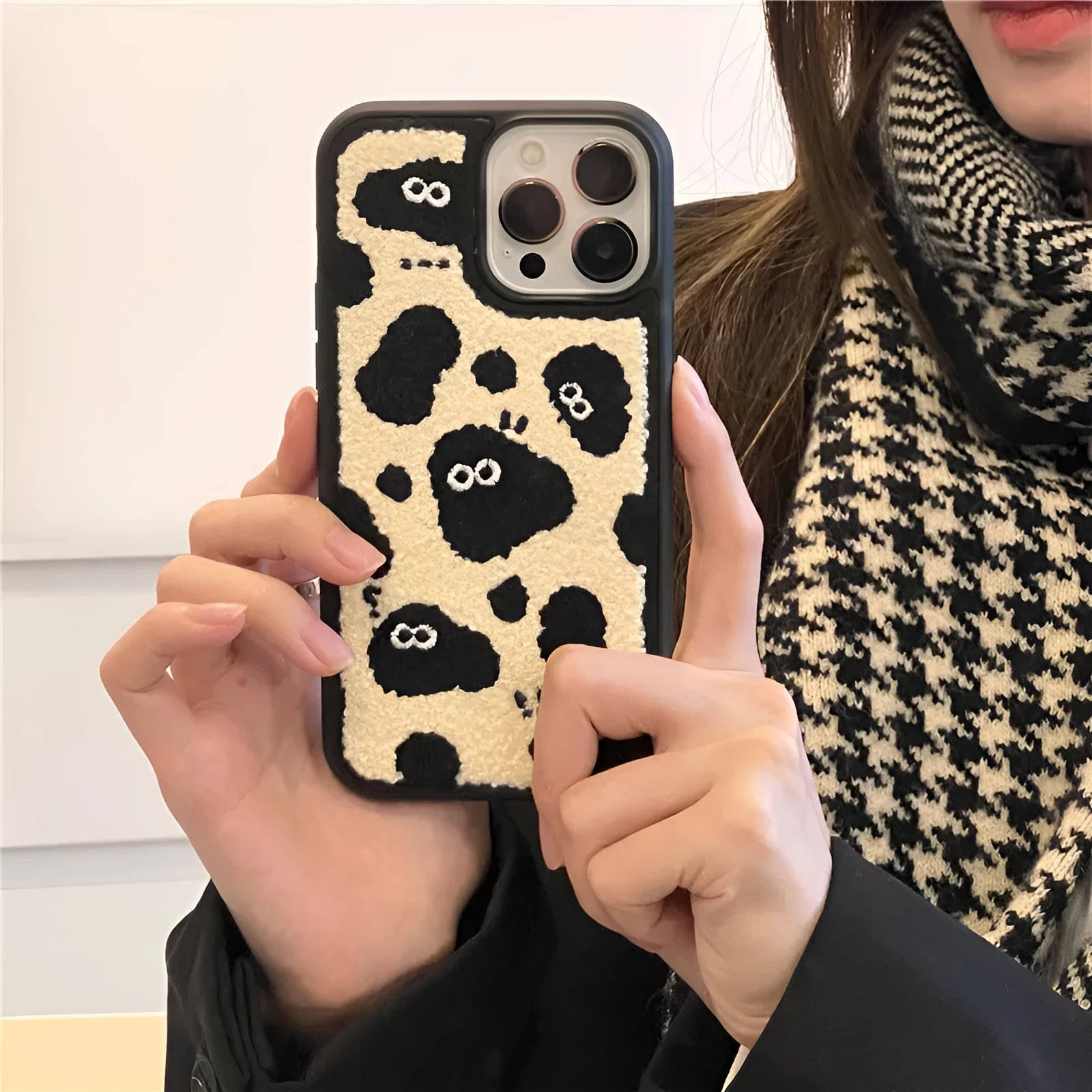 Black plush phone case with a Fairy design for iPhone models