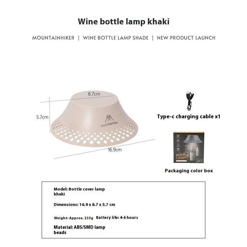 Beige wine bottle-shaped camping lantern with USB-C port and LED light on a wooden surface.