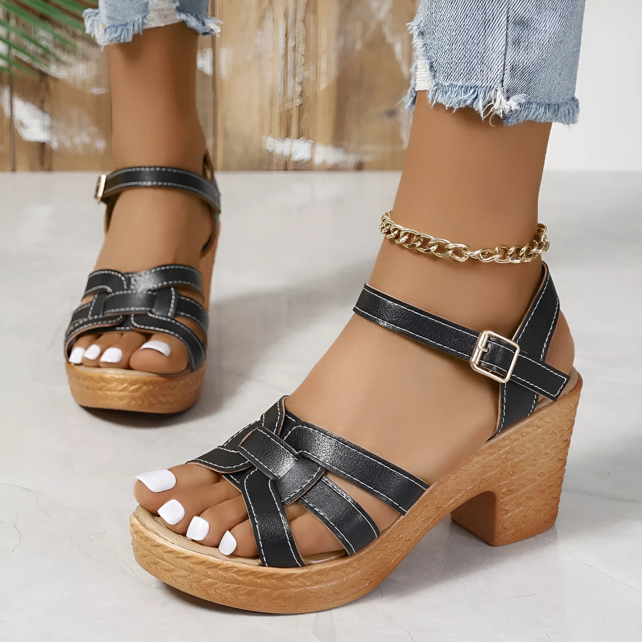 Plus size women's black peep toe sandals with chunky heel and ankle-strap buckle.