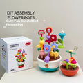 Colourful plastic flowerpot building block set with assorted flower-shaped pieces, in a colour box