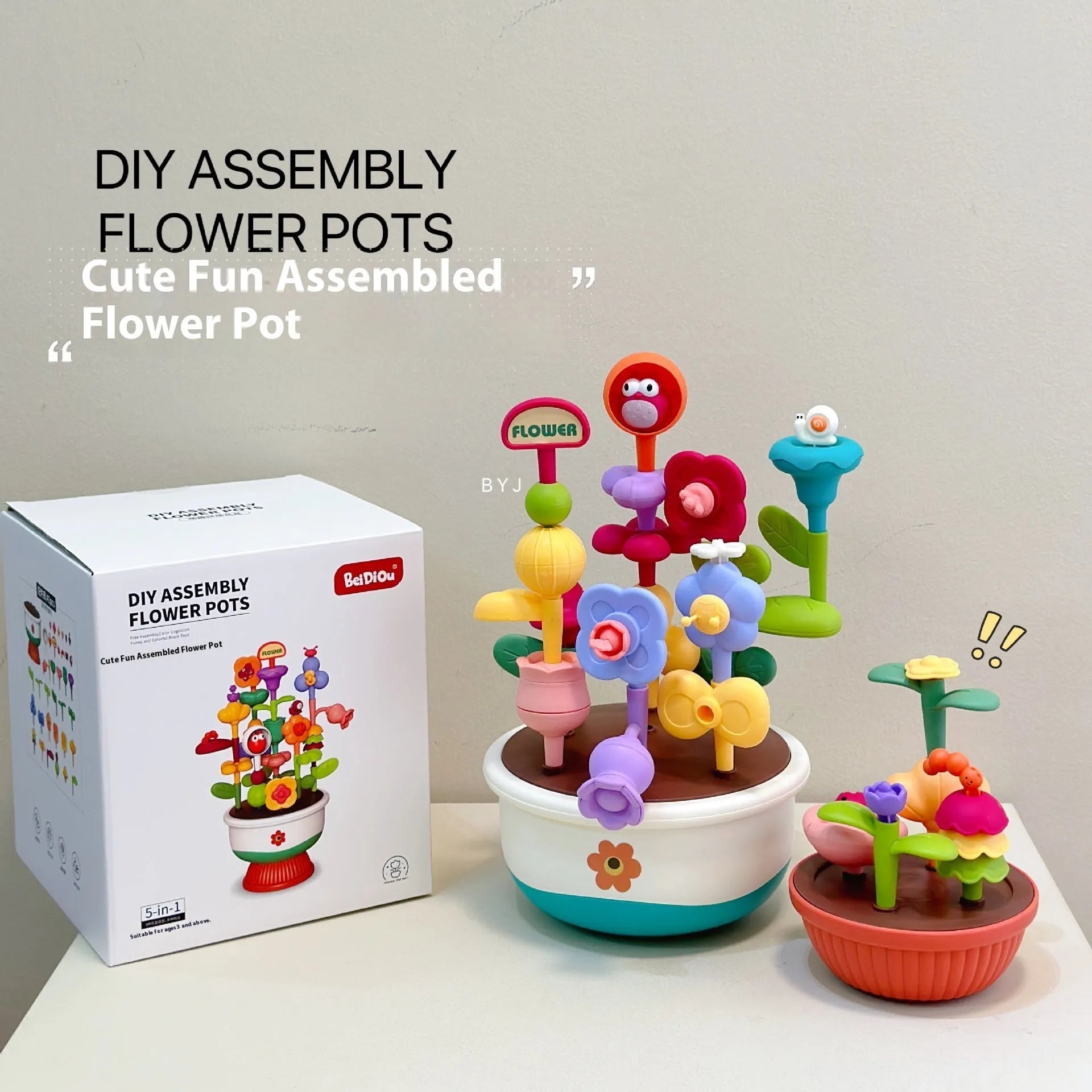 Colourful plastic flowerpot building block set with assorted flower-shaped pieces, in a colour box