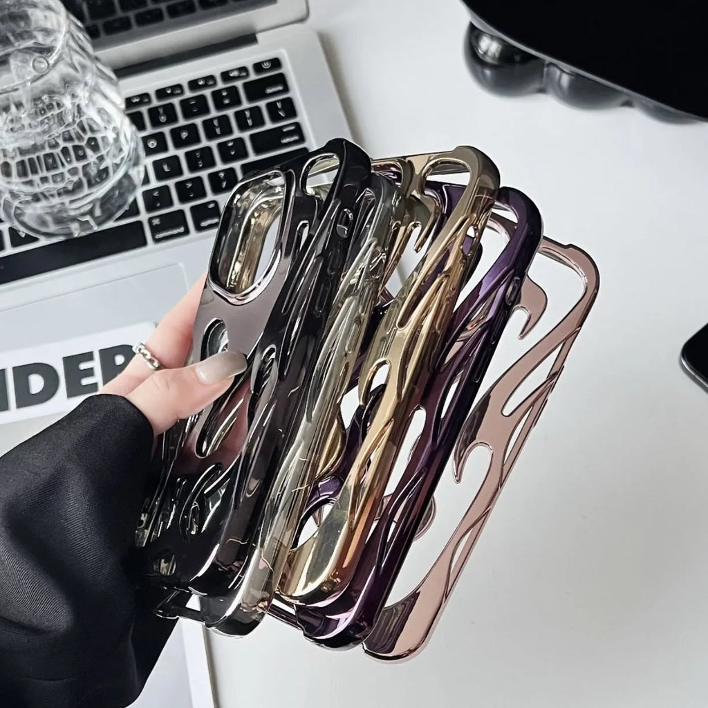 Silver electroplated iPhone case with hollow flame pattern design on a dark background