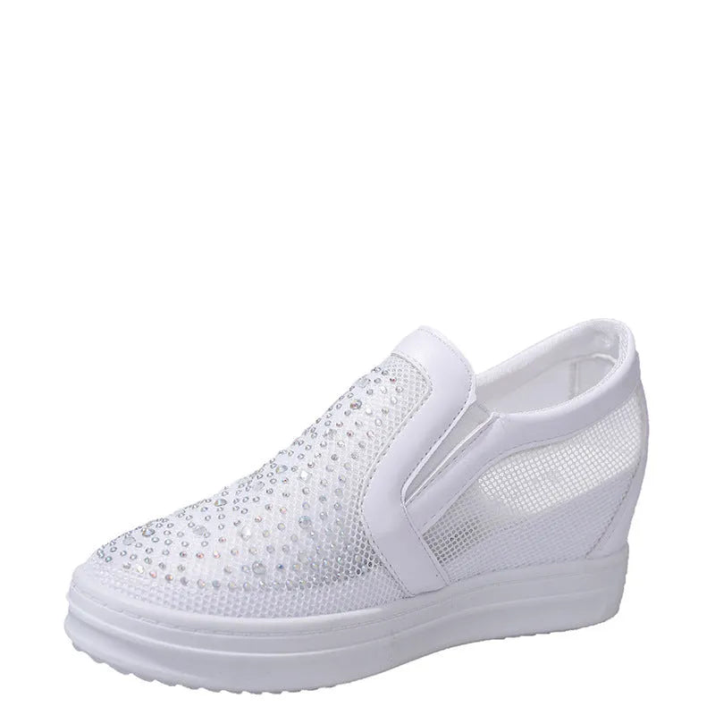 Women's wedge slip-on shoes with mesh upper in black colour showing rubber sole