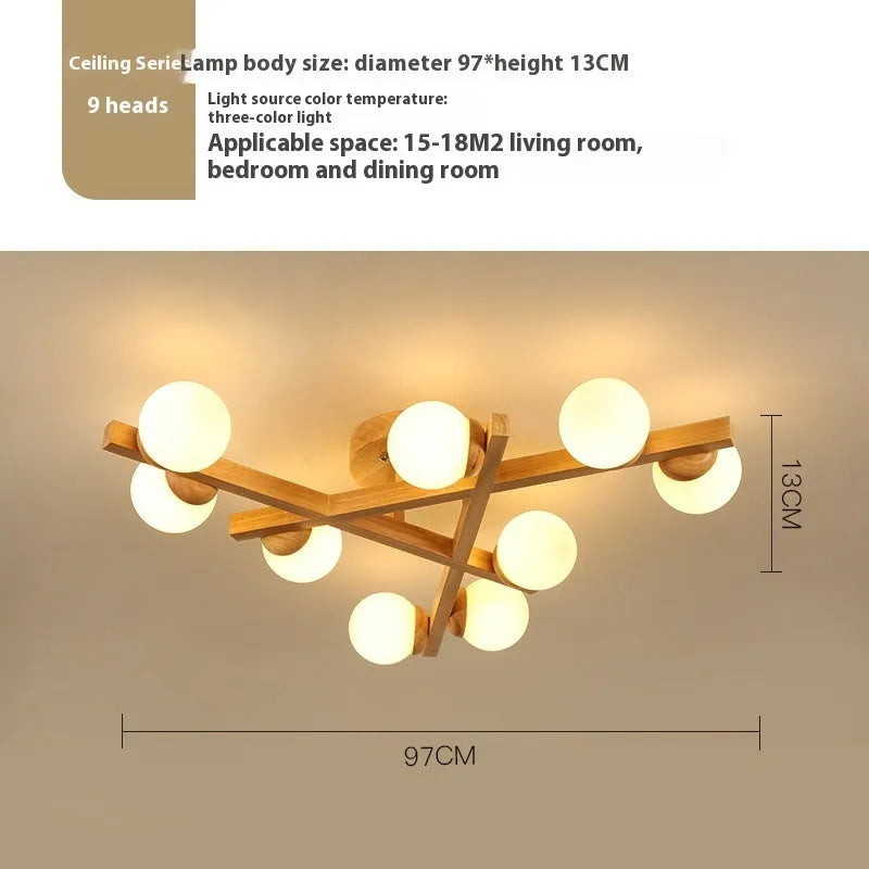 Nordic wooden-style ceiling light with three adjustable heads in a modern living room setting.