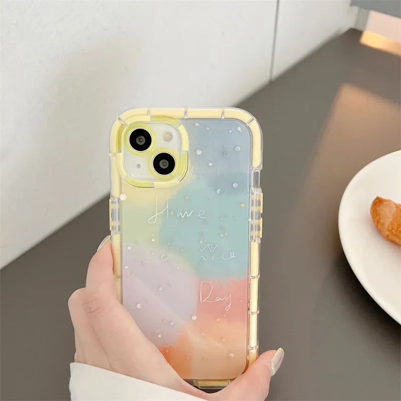 Minimalist two-tone silicone iPhone case with a yellow edge, shown on a phone.
