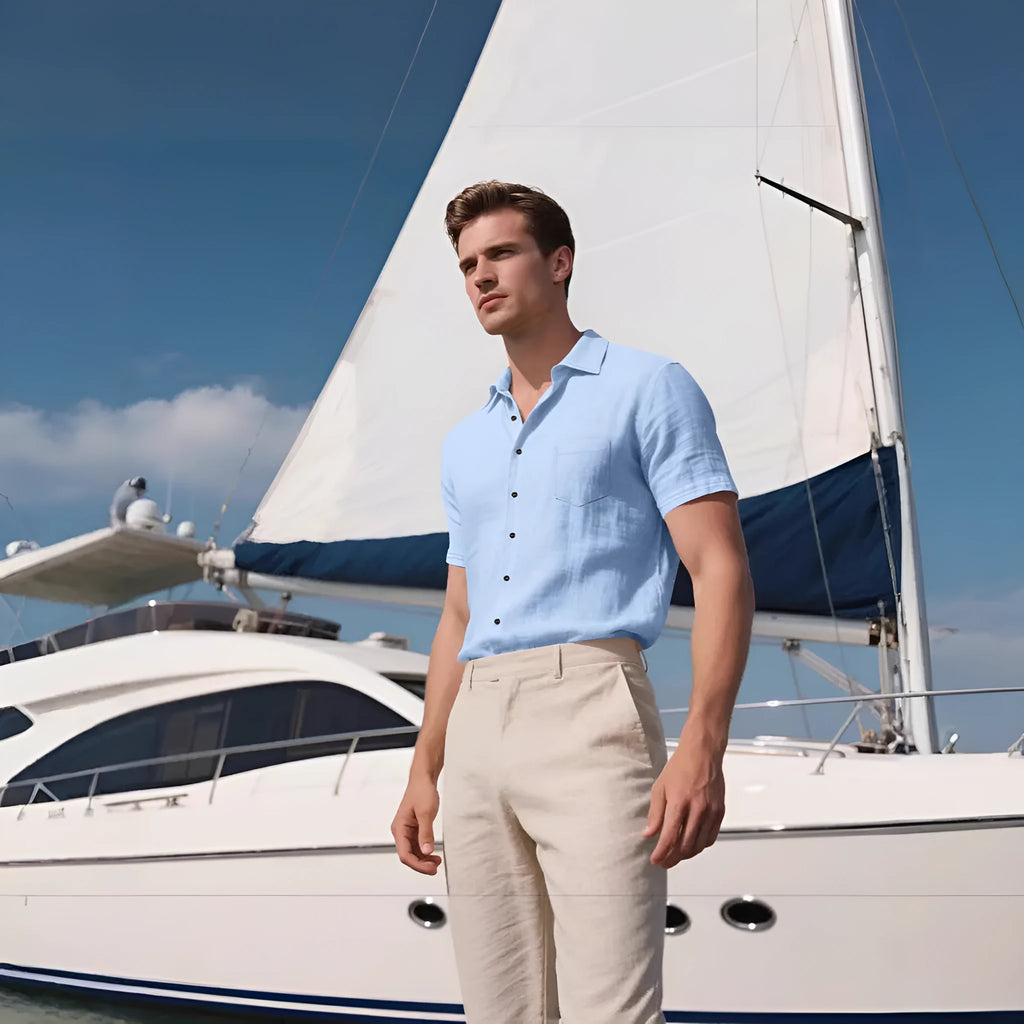 Men's loose fit linen short-sleeved cardigan shirt in a solid colour on a hanger.