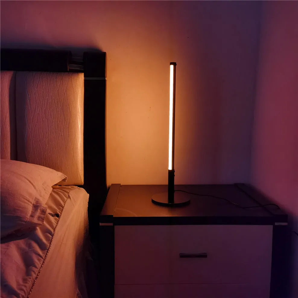 Simple retro black decorative atmosphere lamp with aluminium alloy body on a side table.